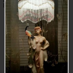 Antique lamp with porcelain statuette